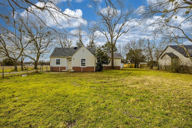 view of yard featuring entry steps and a fenced backyard