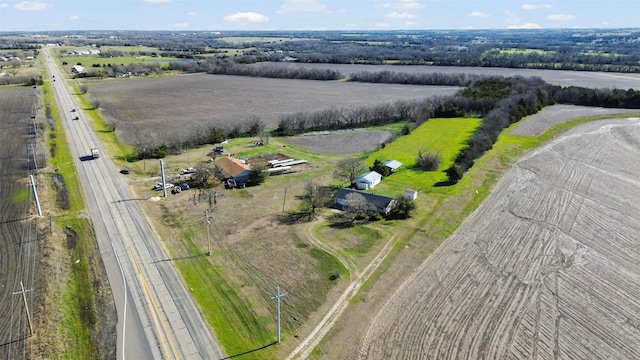 birds eye view of property featuring a rural view