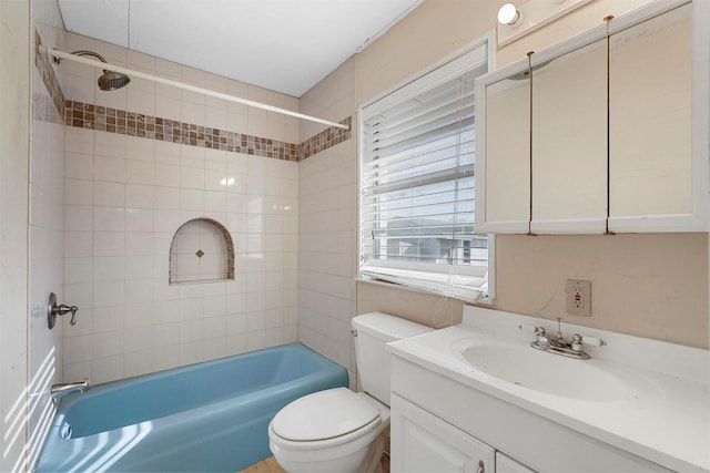 bathroom featuring shower / washtub combination, toilet, and vanity