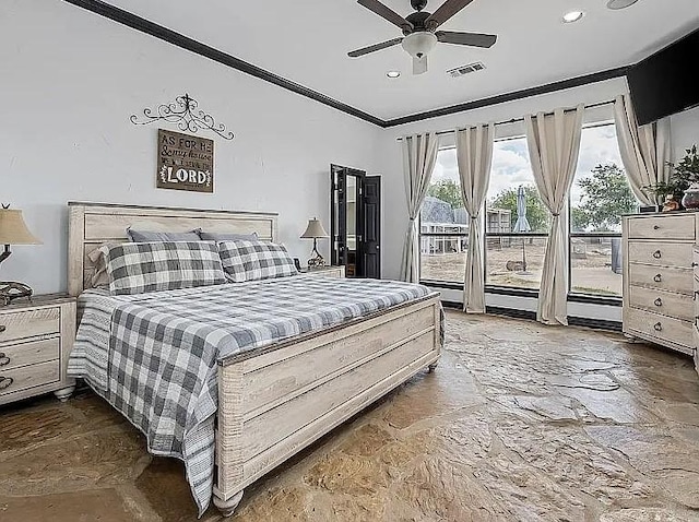 bedroom with visible vents, ornamental molding, stone finish floor, a ceiling fan, and access to outside