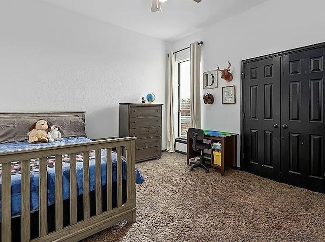 carpeted bedroom featuring a closet and ceiling fan