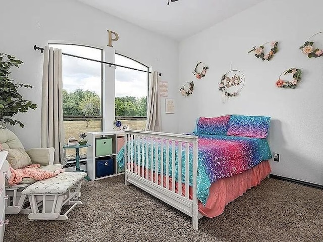 bedroom with carpet flooring and baseboards