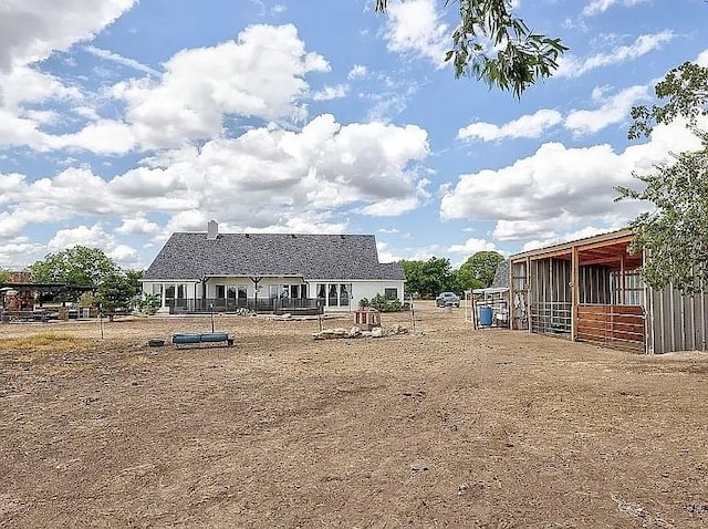 view of yard with an outbuilding and an exterior structure