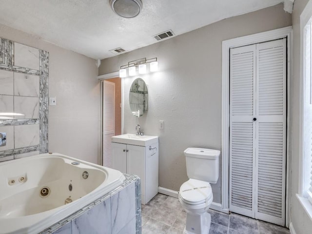 full bathroom with a closet, visible vents, and a tub with jets