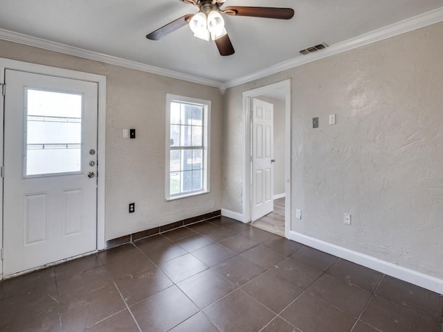 entryway with visible vents, baseboards, a ceiling fan, and crown molding