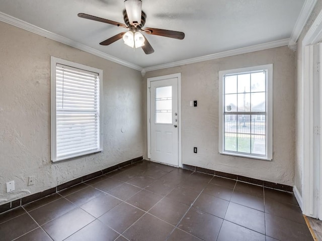 entrance foyer with a textured wall and ornamental molding