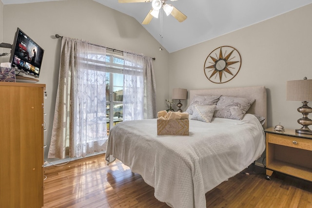 bedroom with lofted ceiling, wood finished floors, and ceiling fan