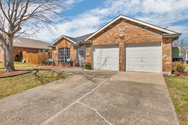 single story home featuring brick siding, a front lawn, fence, driveway, and an attached garage