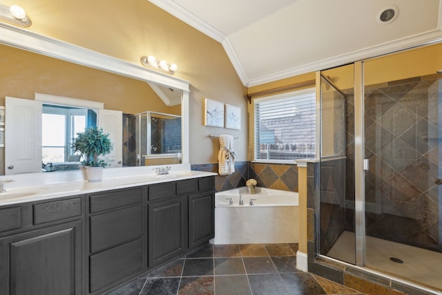 bathroom featuring double vanity, a stall shower, a sink, crown molding, and a bath