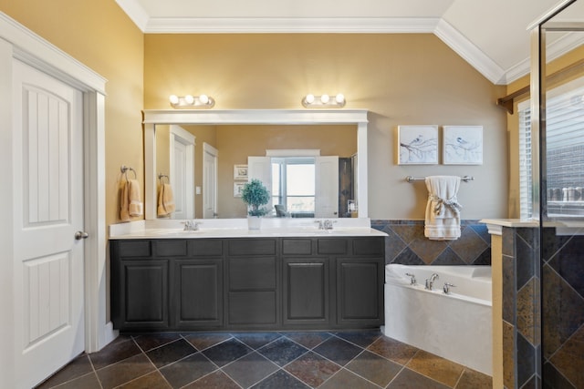 bathroom featuring vaulted ceiling, a garden tub, crown molding, and double vanity