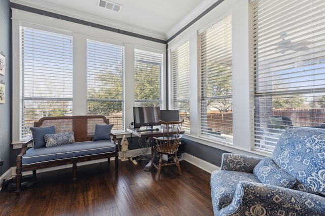 office area featuring visible vents, baseboards, hardwood / wood-style floors, and ornamental molding