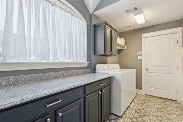 laundry area featuring visible vents, cabinet space, washing machine and dryer, and light tile patterned flooring