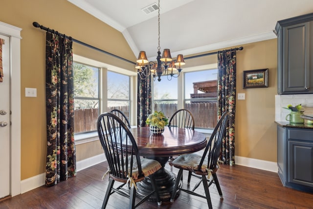 dining room with visible vents, plenty of natural light, an inviting chandelier, and vaulted ceiling