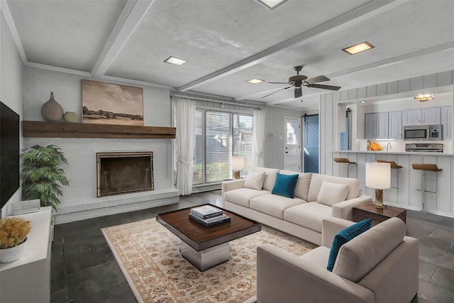 living room with beamed ceiling and a ceiling fan