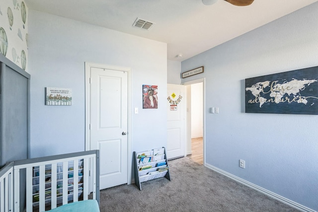 carpeted bedroom with baseboards and visible vents