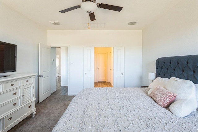 bedroom featuring visible vents, a ceiling fan, and carpet floors