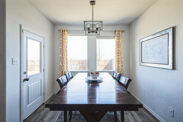 870 Sitwell Dr, Fate, TX 75087 - dining space featuring a chandelier, wood finished floors, healthy amount of natural light, and baseboards