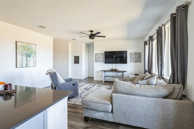 870 Sitwell Dr, Fate, TX 75087 - living room with dark wood-type flooring and a ceiling fan
