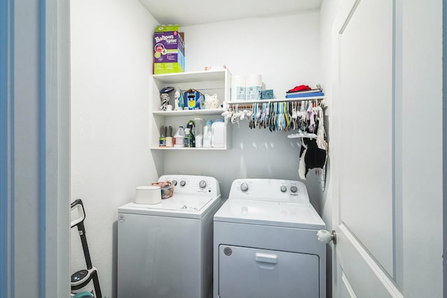 washroom featuring washing machine and dryer and laundry area