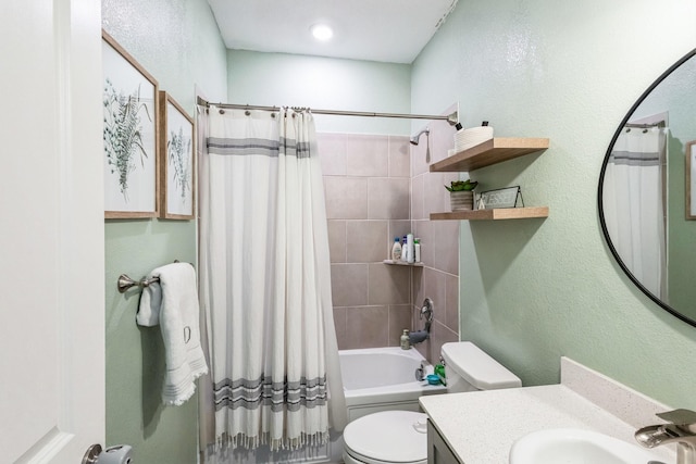 full bathroom featuring a textured wall, toilet, vanity, and shower / bath combination with curtain