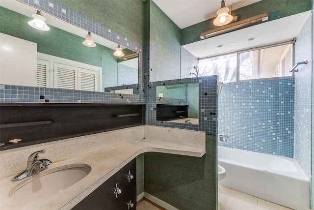 full bathroom with vanity, a shower, and a bathtub