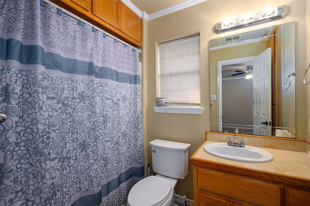 full bathroom featuring vanity, a shower with curtain, visible vents, crown molding, and toilet