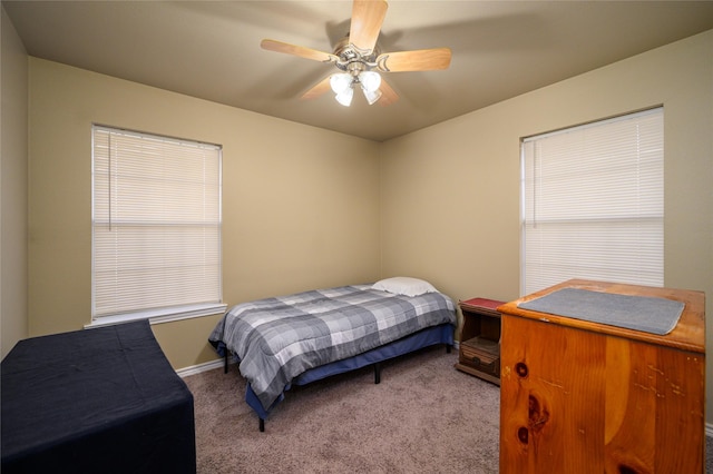 bedroom featuring baseboards, ceiling fan, and carpet floors