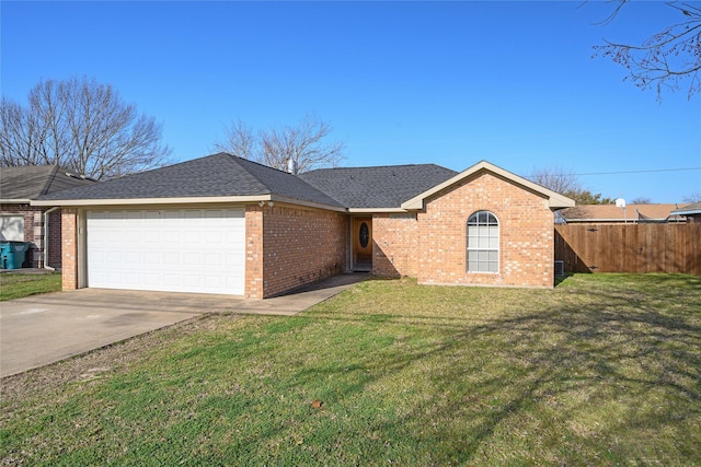 ranch-style house with brick siding, an attached garage, a front lawn, and fence