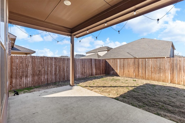 view of yard featuring a patio and a fenced backyard