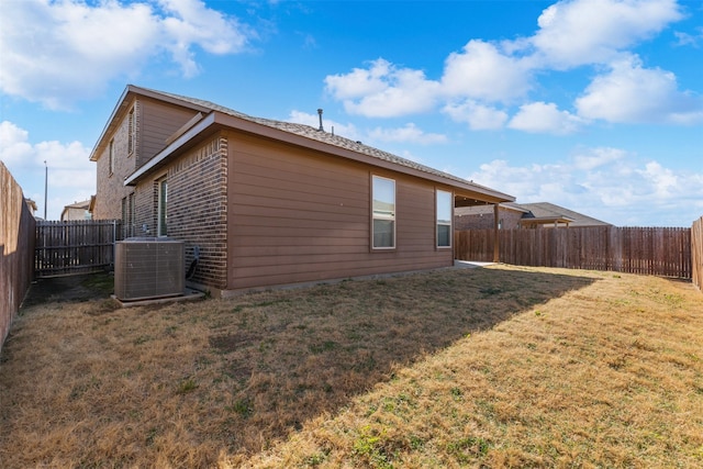 view of property exterior featuring cooling unit, a yard, and a fenced backyard