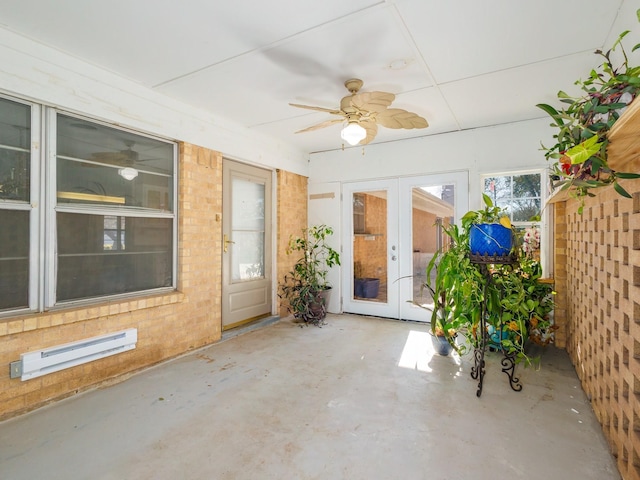 unfurnished sunroom with baseboard heating, french doors, and ceiling fan