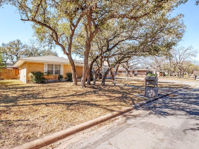 view of front of house with fence