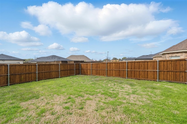 view of yard featuring a fenced backyard