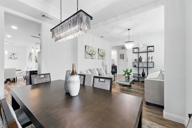 dining room with visible vents, baseboards, a chandelier, recessed lighting, and wood finished floors