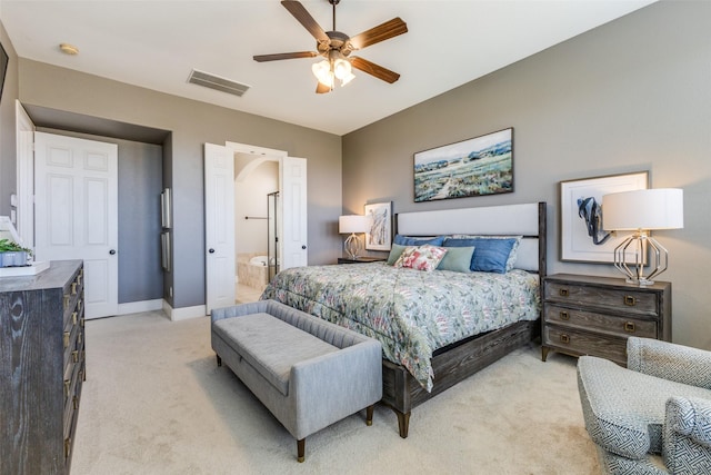 bedroom with baseboards, visible vents, arched walkways, ceiling fan, and light carpet