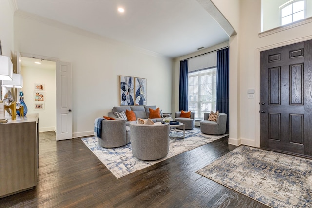 entryway featuring dark wood-type flooring, baseboards, and ornamental molding