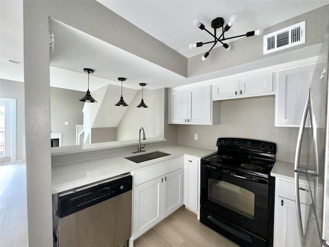 kitchen with a sink, light countertops, visible vents, and stainless steel appliances