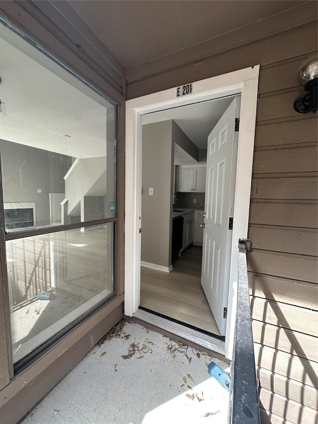 doorway to property featuring a sink