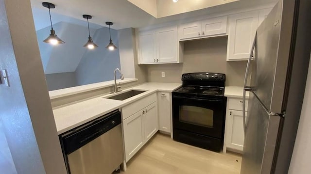 kitchen featuring a sink, stainless steel appliances, and white cabinetry