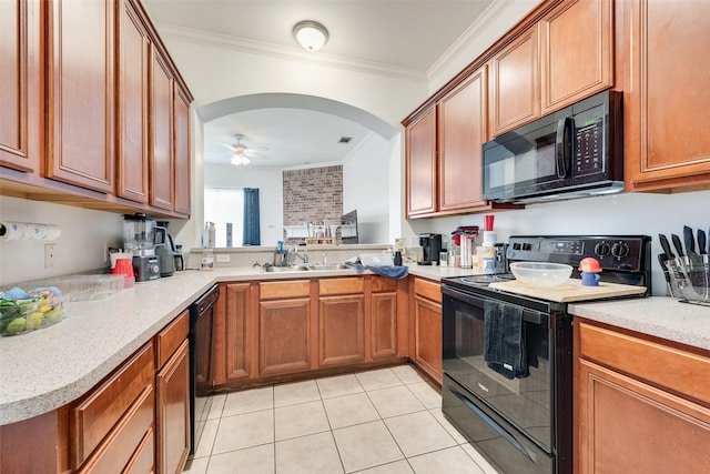 kitchen featuring ceiling fan, a sink, black appliances, crown molding, and brown cabinets