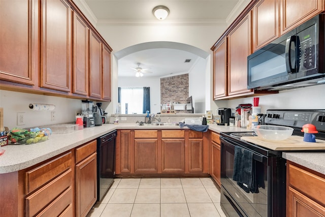 kitchen with a sink, black appliances, a ceiling fan, and crown molding