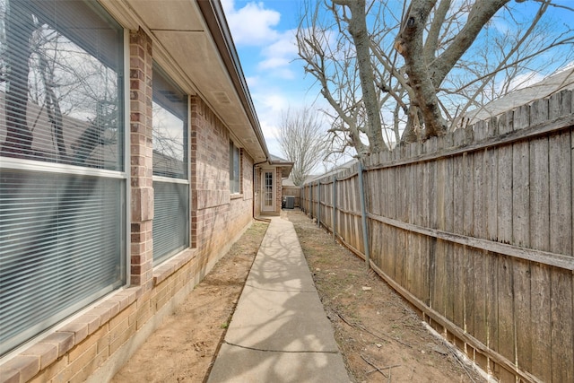 view of home's exterior with fence