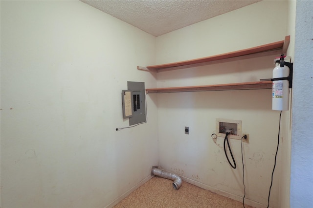 clothes washing area with laundry area, electric panel, electric dryer hookup, washer hookup, and a textured ceiling