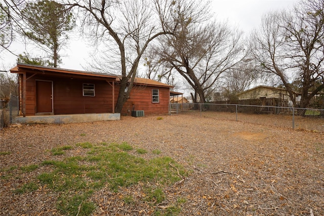 view of yard with central AC unit and a fenced backyard