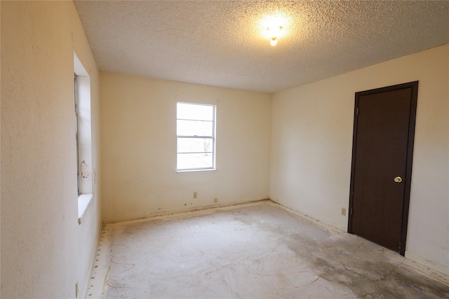 unfurnished bedroom with a textured ceiling