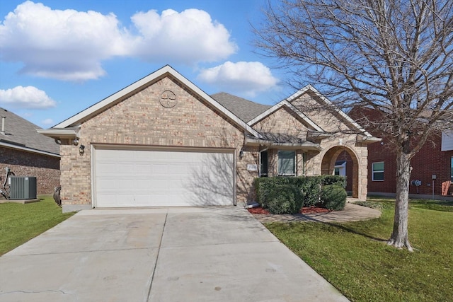 view of front of house with central AC, a front lawn, concrete driveway, and a garage