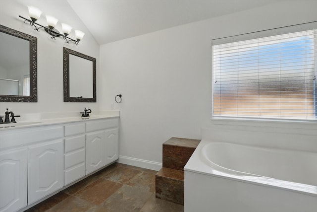 full bath featuring double vanity, a bath, lofted ceiling, and a sink