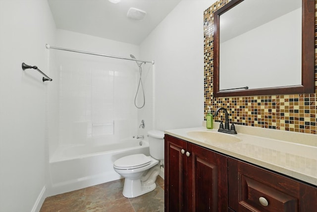 bathroom featuring backsplash, toilet, vanity, and bathing tub / shower combination