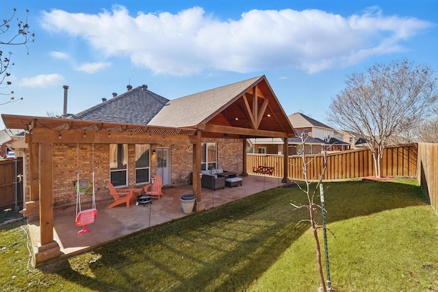 back of property featuring a lawn, a patio, a fenced backyard, a shingled roof, and an outdoor hangout area