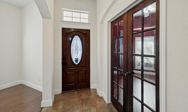 entrance foyer with french doors and baseboards